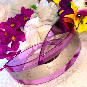 Transparent purple fashion sunglasses with silver strip.